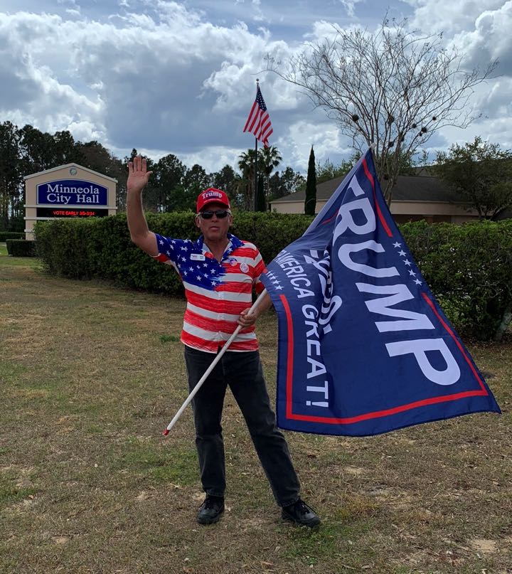 Tom Vail flag waiving ALONE on Presidential Primary Day at the Poll - Minneola, FL