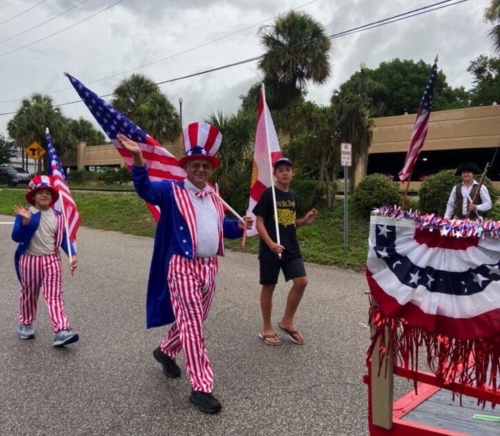 Tom Vail with Robert and Ben in parade